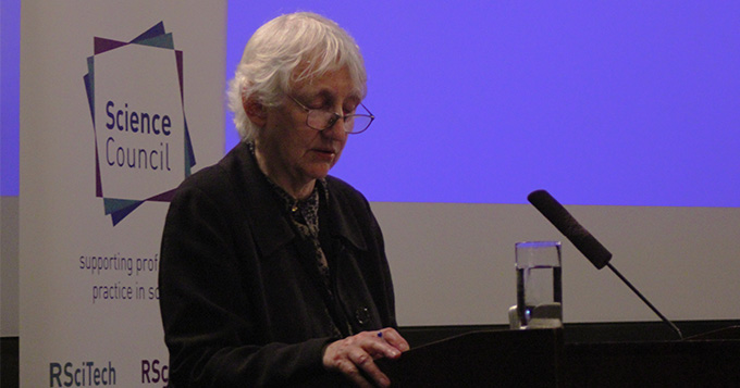 Baroness O’Neill of Bengarve standing at a podium delivering a lecture