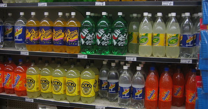 Fizzy drinks bottles on a supermarket shelf