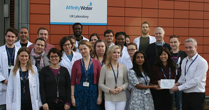 Plaque presentation with group of Affinity Water staff outside their laboratory building