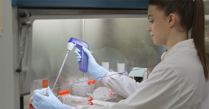 Science technician Emma Bennison working in a laboratory.